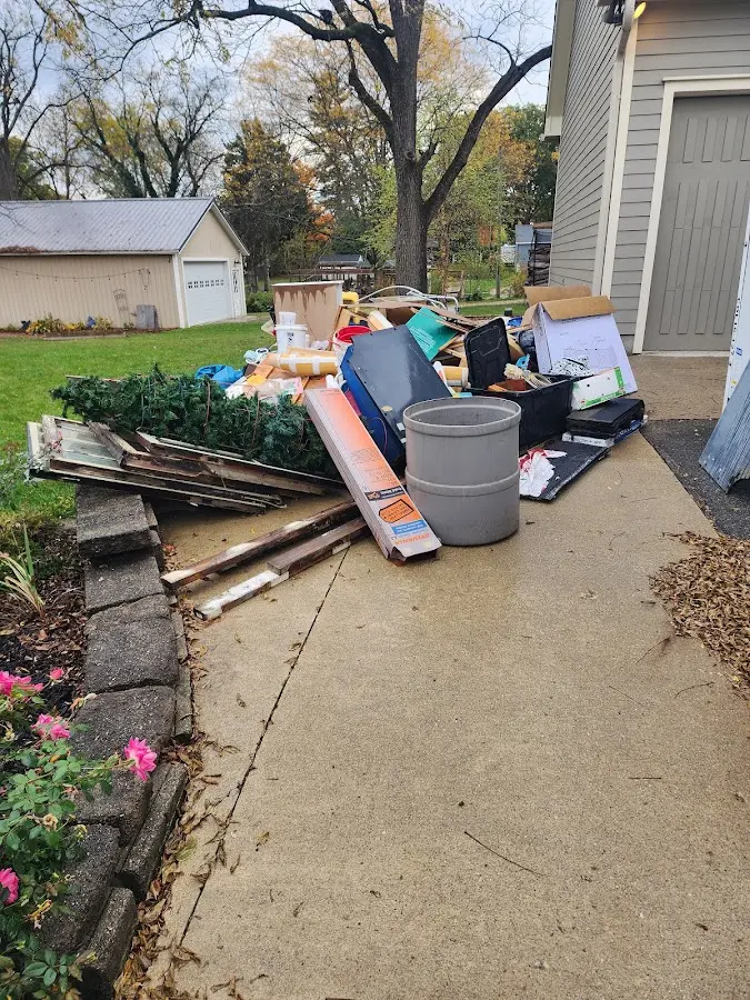Dumpster being loaded with debris for Roofing Dumpster Rental in Cleveland